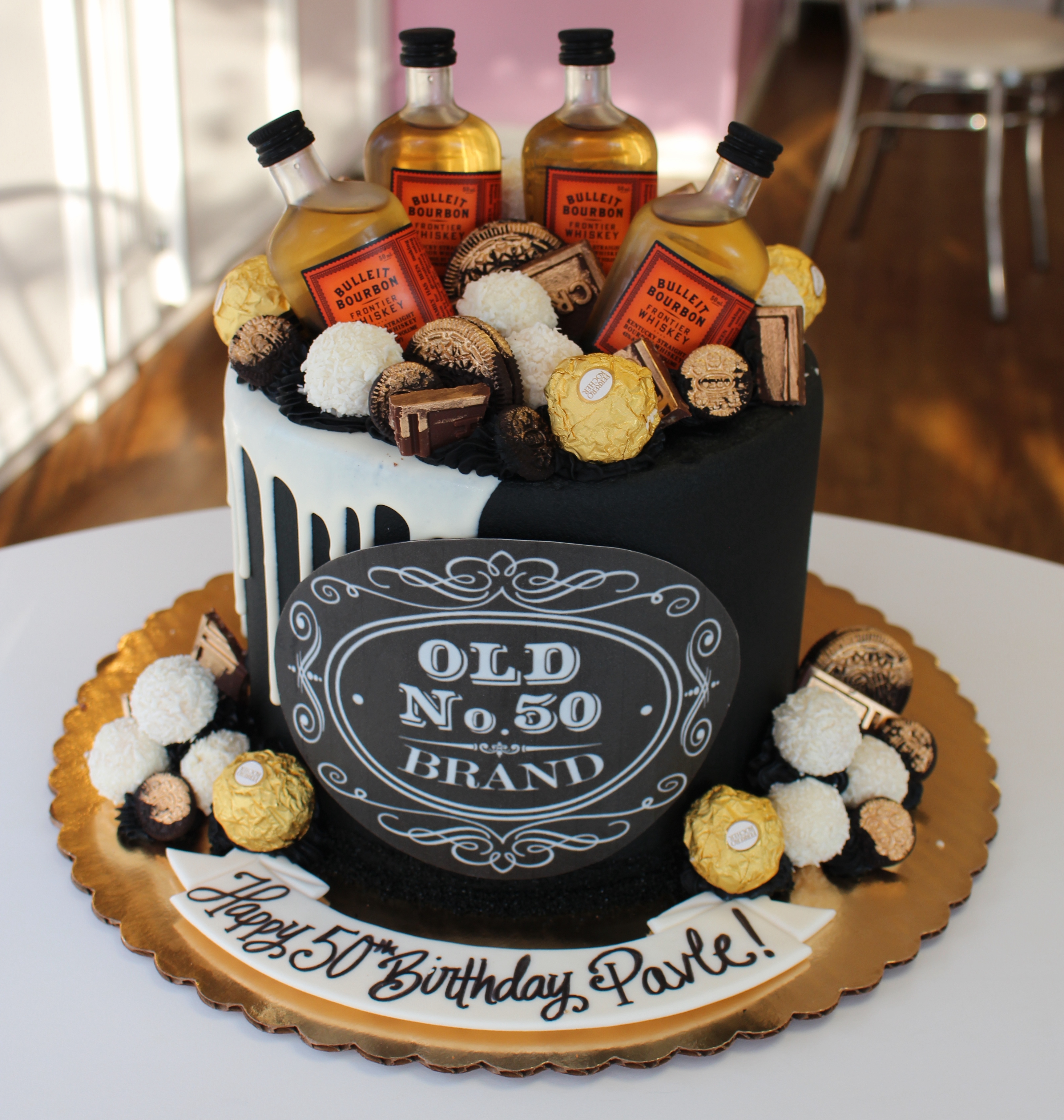 Black and White Half Drip Jack Daniels Theme Birthday Cake with Mini Bottles and Gold Brushed Cookies and Candies
