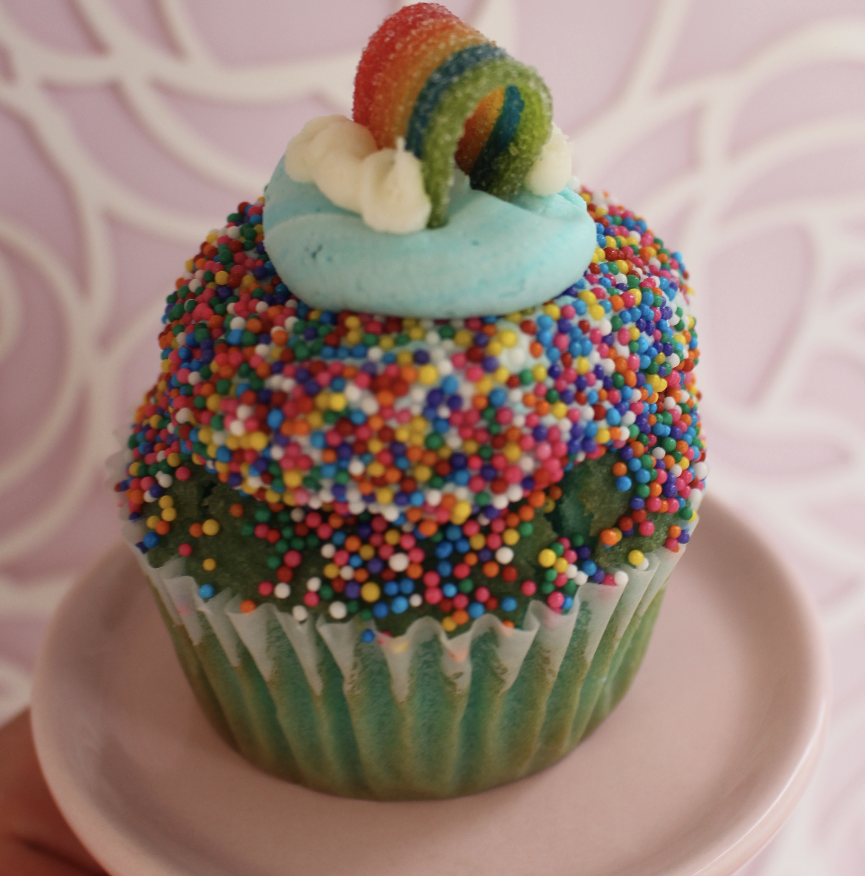 Blue velvet cake with blue buttercream, sprinkles, and a candy rainbow!